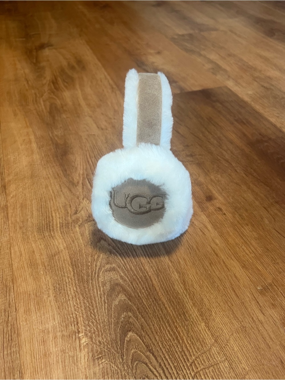 Kids UGG On-Ear Shearling Headphones in White and Tan.